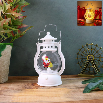 Mini Santa LED lantern glowing with warm light on a wooden surface.