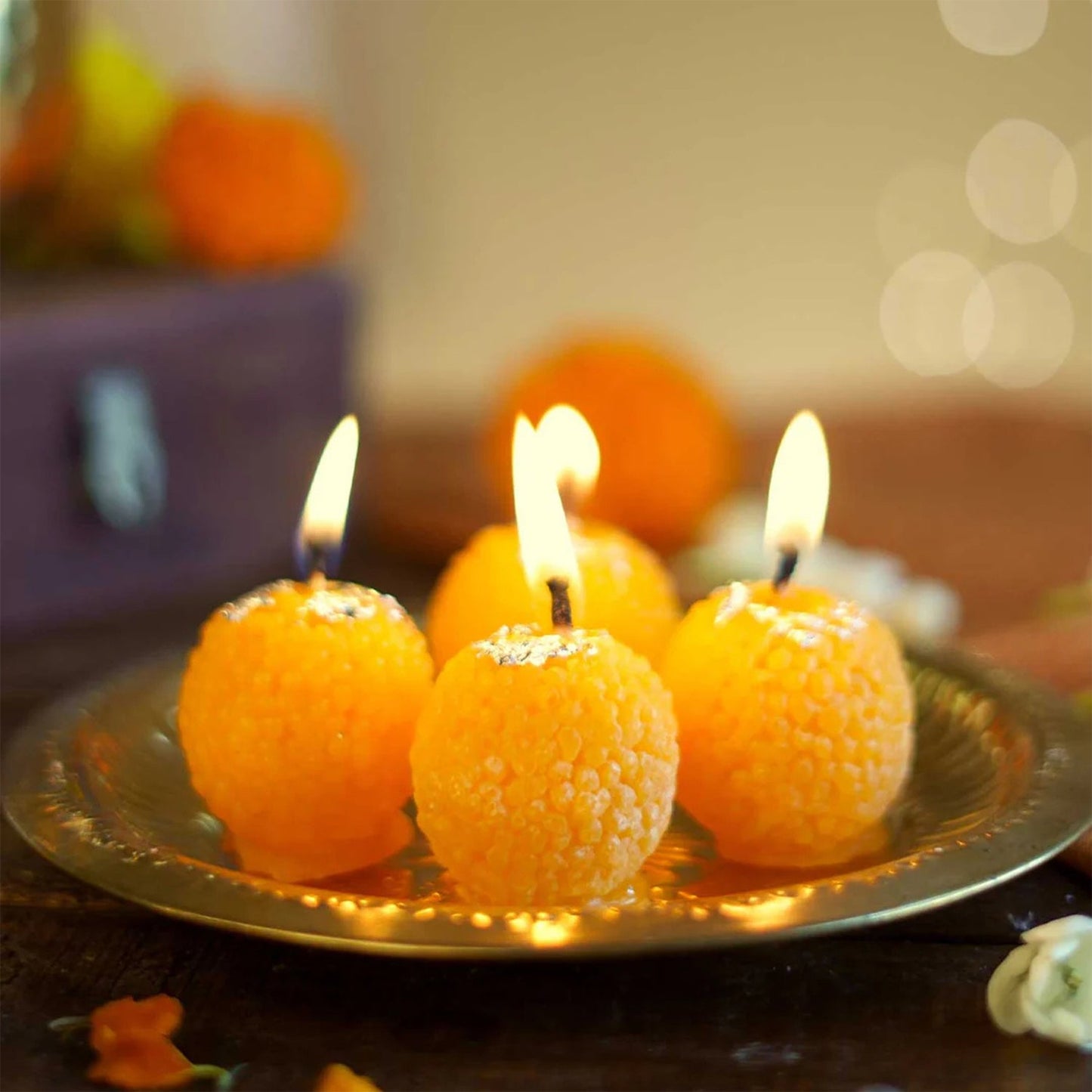 Close-up of laddu shaped wax candle showing detailed craftsmanship