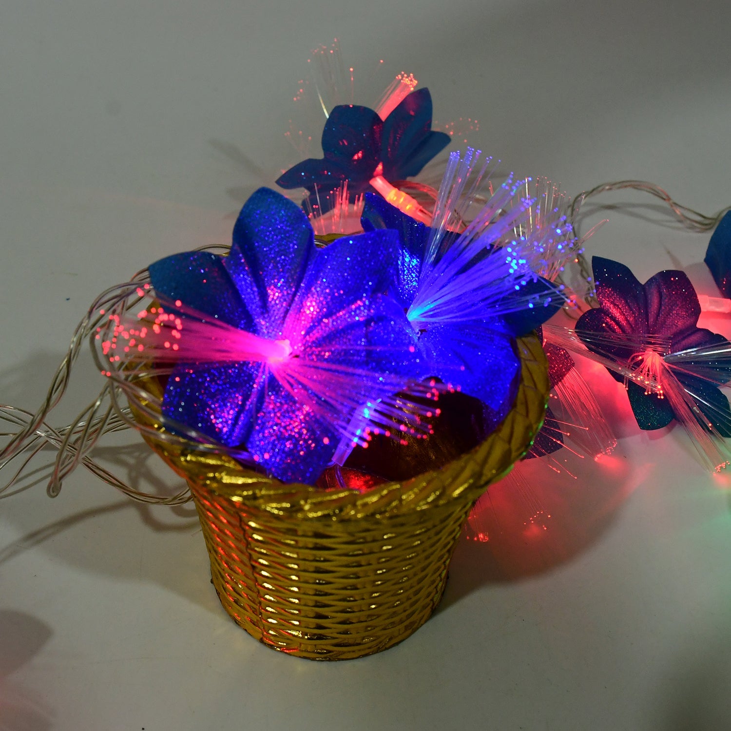 Energy-efficient fiber flower LED string lights with vibrant multicolor flowers decorating balcony