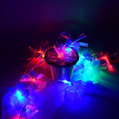 Hanging decorative fiber flower LED string lights creating ambient warm glow for outdoor events