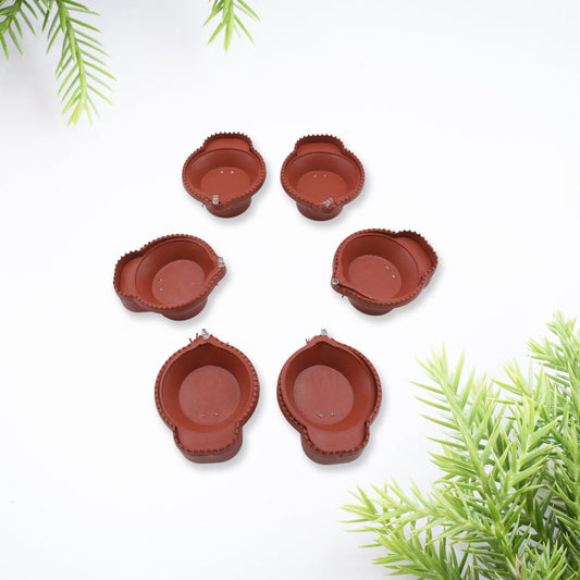 Water Sensor Diyas glowing brightly in a traditional setting for Diwali decoration.