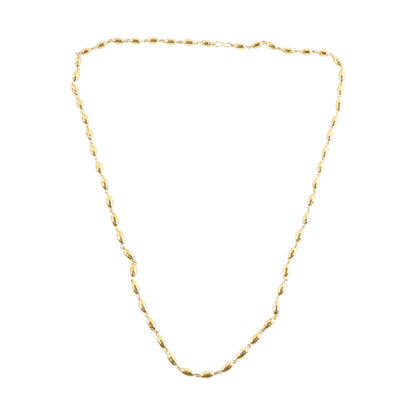 Close up view of gold tone oval bead necklace chain detail