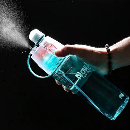 Transparent 600ML spray water bottle showing capacity markings and a secure, leak-proof lid.