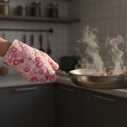 Hand using a heat-resistant oven mitt to safely handle a hot baking dish.