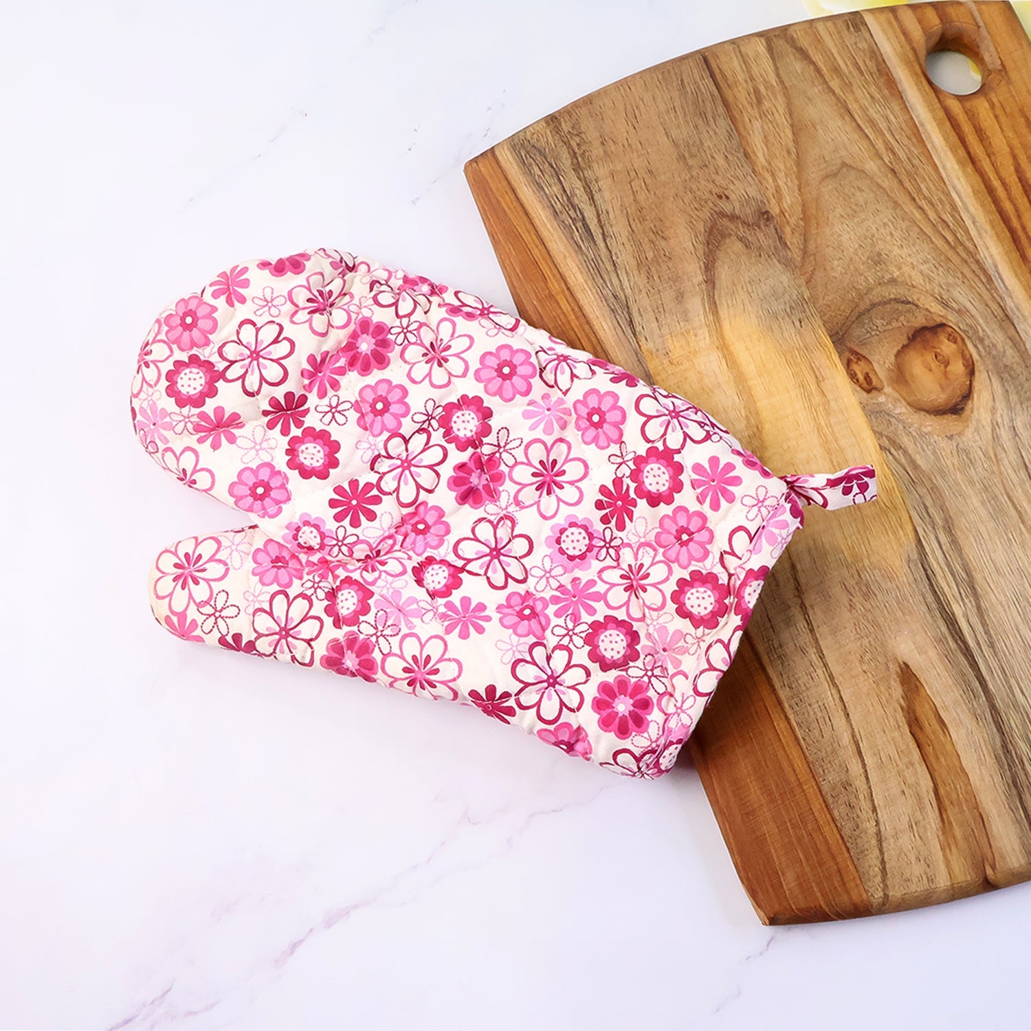 Thickly cushioned pot holder with a matching designer print.