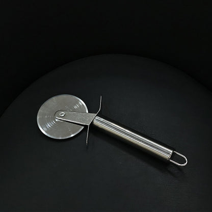 Detail of stainless steel pizza cutter with sharp blade