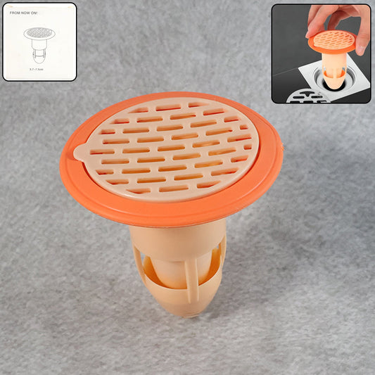 Plastic drain strainer with hair catcher installed in a bathroom shower drain