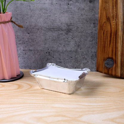 Open disposable aluminium container showing interior space for food
