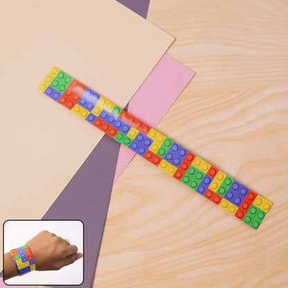 Single colorful snap slap bracelet toy displaying bright colors