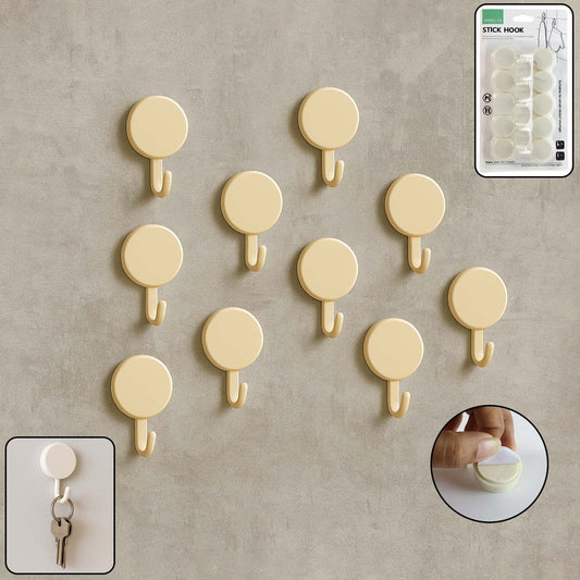 Set of 10 self adhesive round wall hooks arranged neatly for home organization