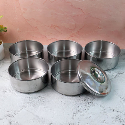 Closed stainless steel lunch box showing its sleek, round design.