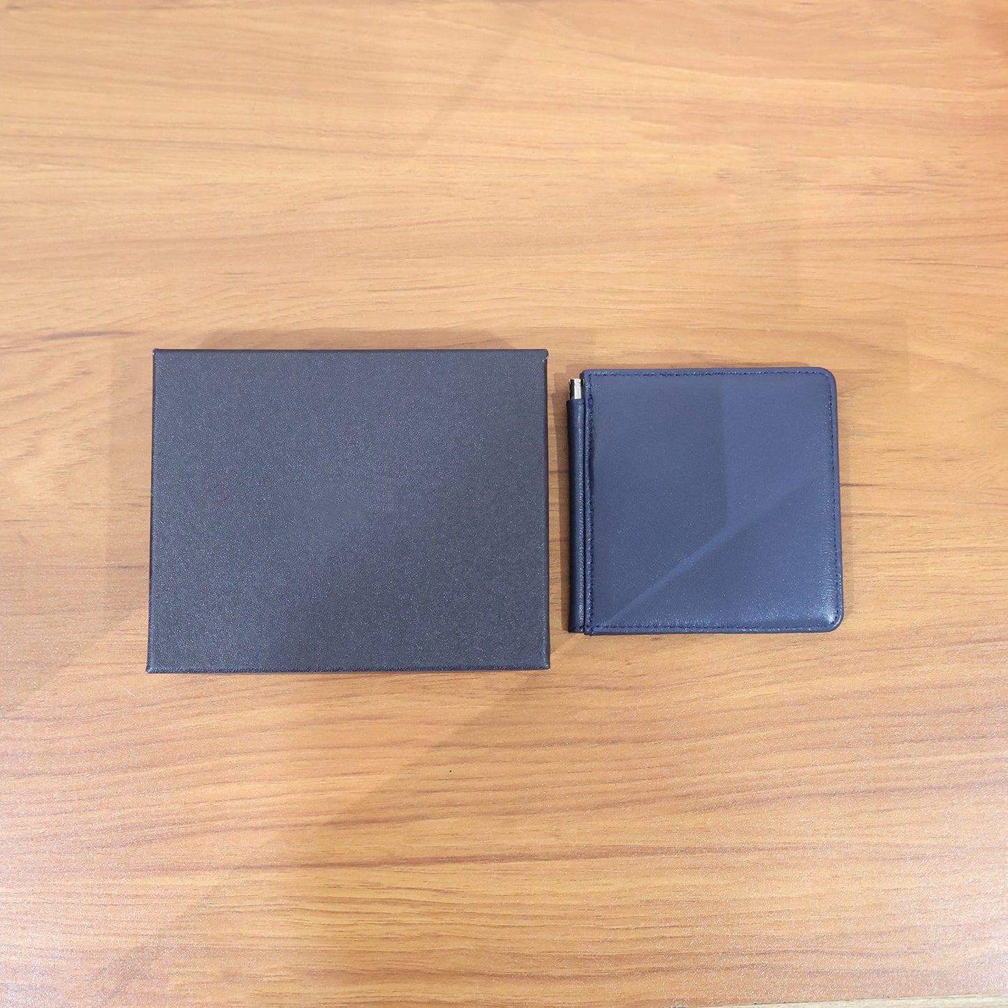 Slim leather-style bi-fold wallet for men showcasing clean professional design