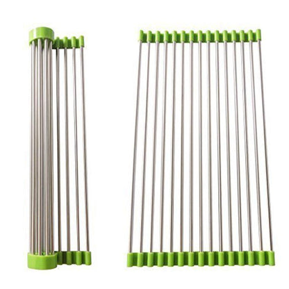 Stainless steel kitchen sink drain rack, extended over a sink for drying dishes.