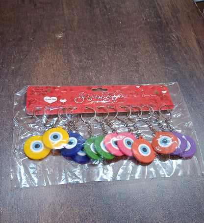 Assorted color evil eye silicone keychains laid out neatly