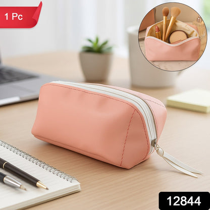 Open PU leather cosmetic pouch showcasing its spacious main compartment and inner slip pocket.