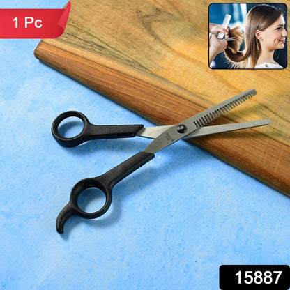 Angled view of hair thinning scissors showing micro-toothed blade for precise thinning
