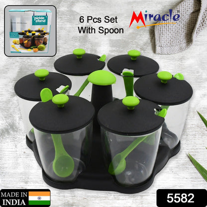 Top-down view of the revolving spice rack, showcasing its sleek design and six clear jars.