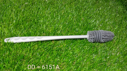 A bottle cleaning brush shown cleaning a narrow-necked bottle with ease.