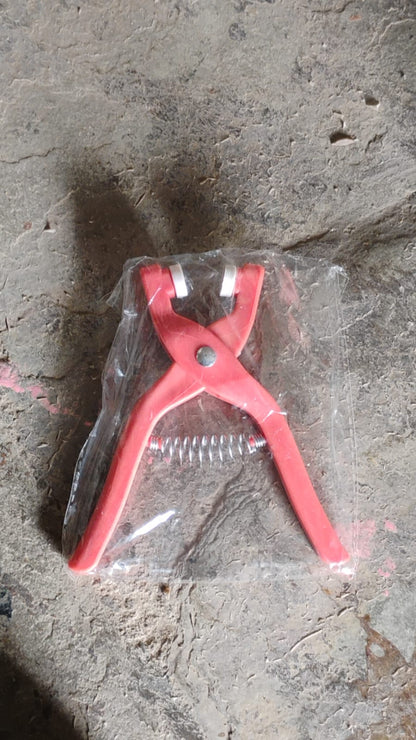 Multiple eyelets and the eyelet pliers demonstrating their versatility on different fabrics.
