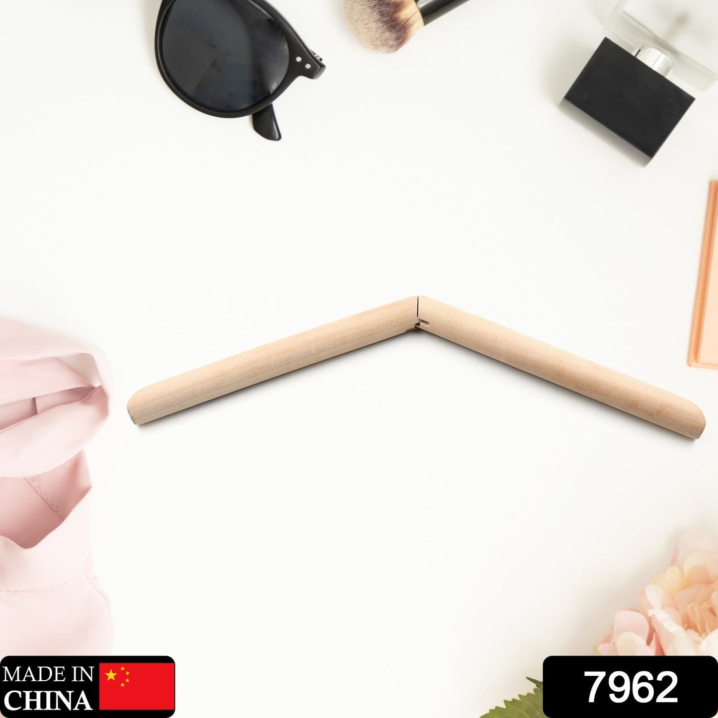 Set of elegant wooden coat hangers displayed neatly in a wardrobe.