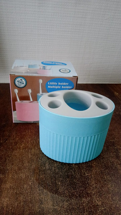 Bathroom countertop toothbrush and utility holder with waterproof design
