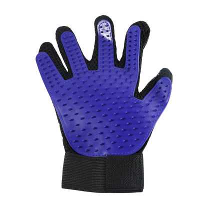 A person using the flexible deshedding glove to comfort and groom their cat.