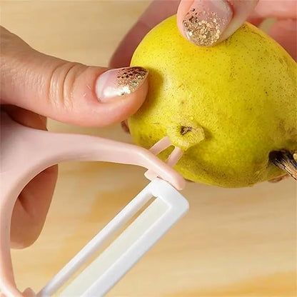 The versatile vegetable peeler alongside a pile of freshly peeled veggies.