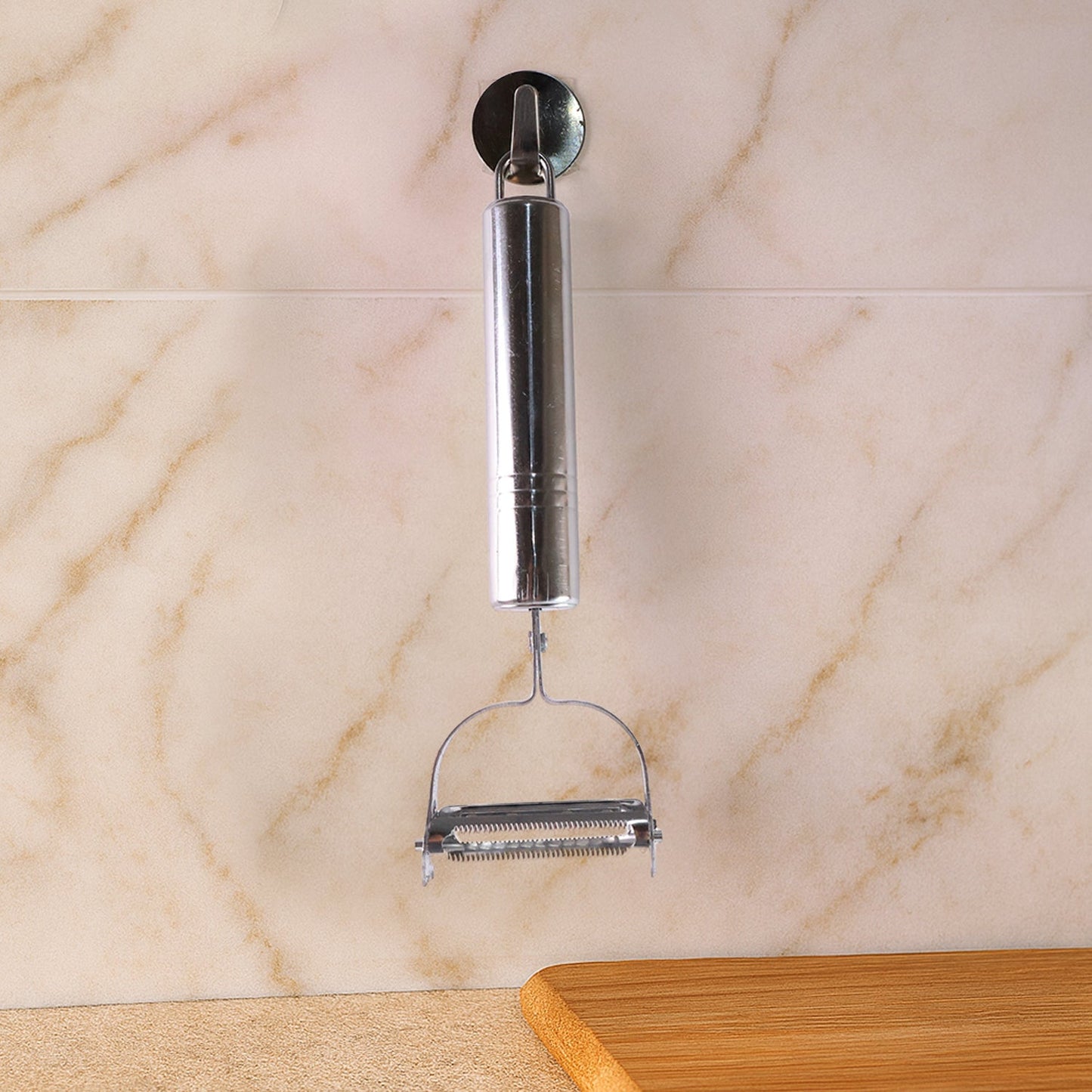 Heavy duty stainless steel vegetable peeler showing sharp dual blades