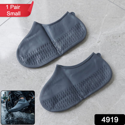 A pair of flexible, small silicone shoe covers displayed on a clean surface.